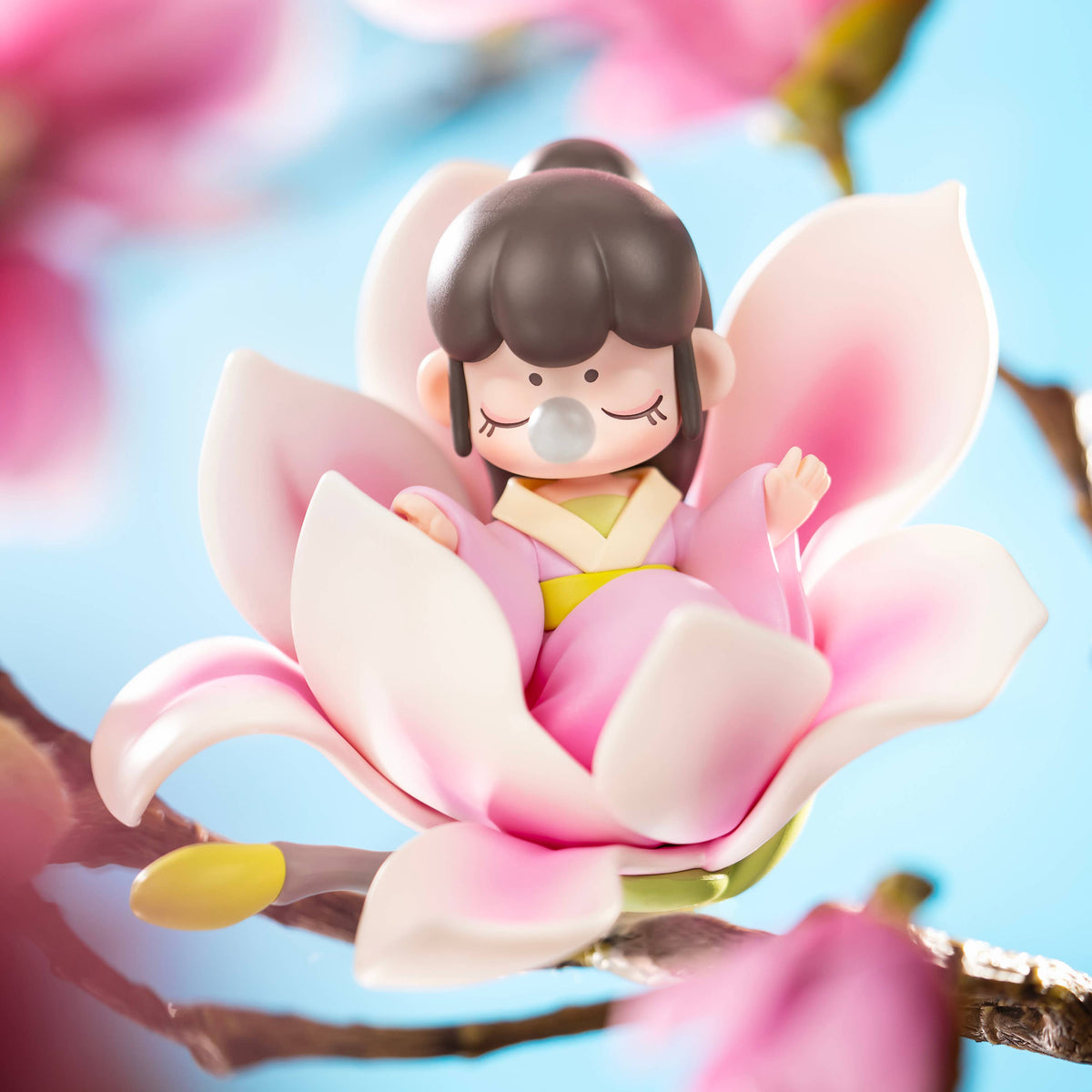 Nanci Flower Stories figure sitting inside a large pink flower.