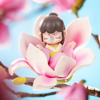 Nanci Flower Stories figure sitting inside a large pink flower.