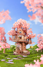 Completed Rolife Sakura Tree House TGS04 wooden 3D puzzle in a cherry blossom garden scene