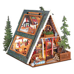 Rolife A-Frame Cabin DG181 DIY miniature house with open two-level interior, steep roof, pine trees and front deck