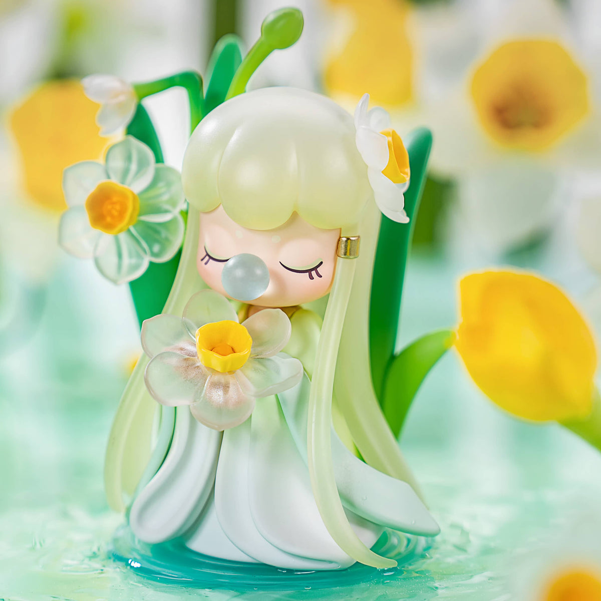 Nanci Flower Stories figure with pale green hair holding a small yellow-centered white flower.