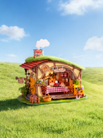 Rolife Fluffy Grove DG184 miniature cottage on green grass beneath a blue sky