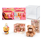 Sweetland Cake Shop Deluxe bundle: two equal square books, assembled cake shop, example Nanci bear and box, bee keychain and clear display case. Bear design varies.