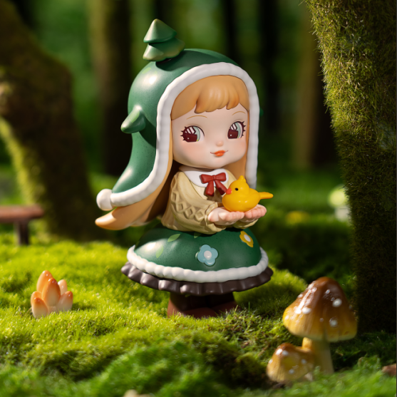 Rolife Charline Forest's Children figure in a green tree-shaped hood holding a small yellow bird.