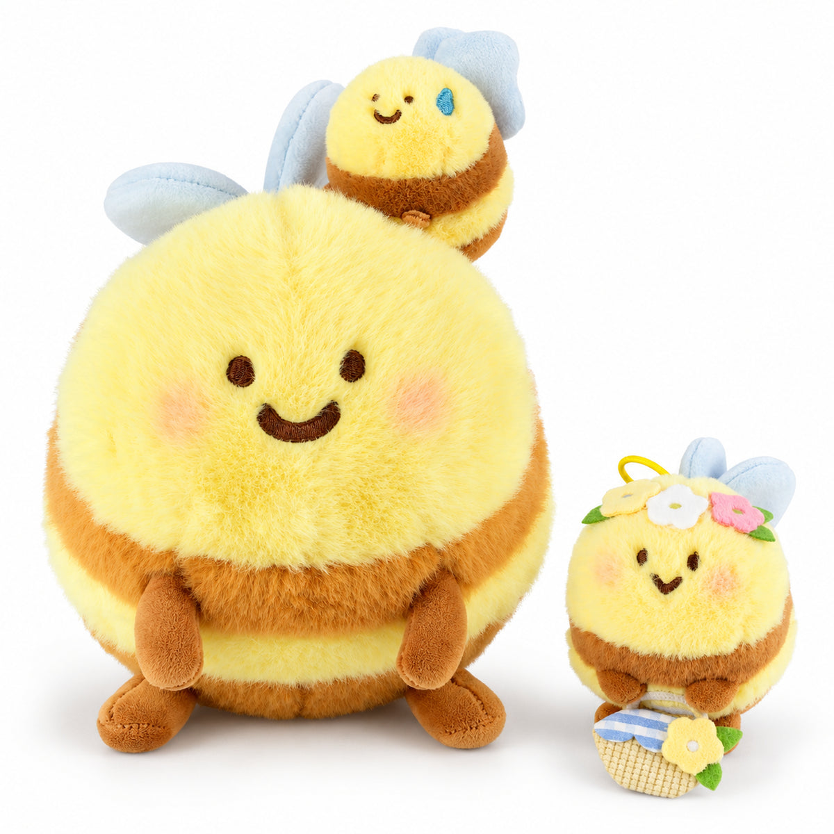 Adored large Hugging Bees plush beside the small flower bee keychain on a white background.
