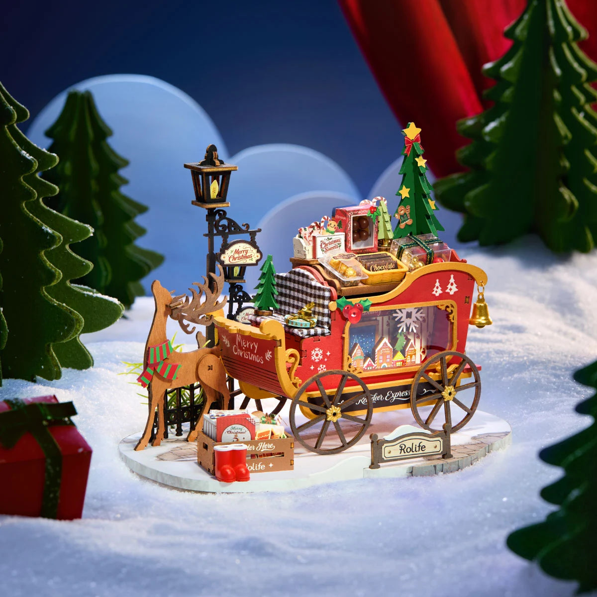 Rolife Reindeer Express DS059 reindeer-and-sleigh Christmas miniature displayed against a blue snowy backdrop