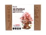Front view of the Rolife Sakura Tree House TGS04 wooden 3D puzzle box with completed model illustration