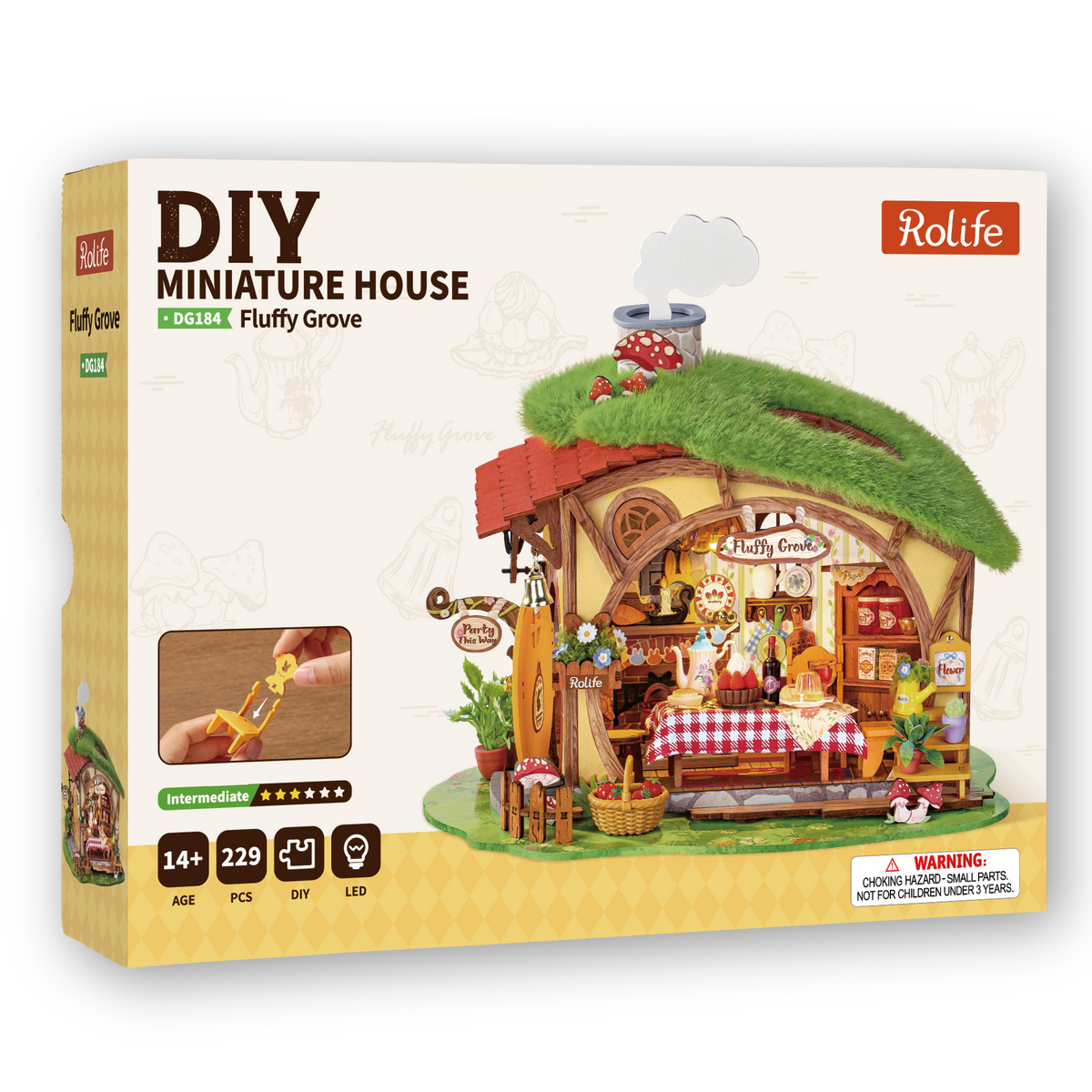 Front of the Rolife Fluffy Grove DG184 DIY miniature house kit box showing the grass-roof cottage