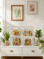 Rolife Fluffy Grove DG184 displayed with three other miniature houses in a shelf arrangement