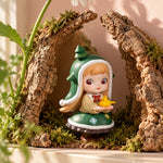 Example Rolife Charline Forest's Children figure in a green hood, displayed among bark and moss. Blind-box design varies.