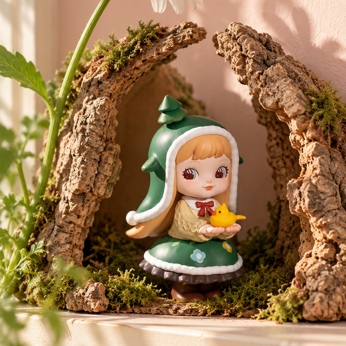 Example Rolife Charline Forest's Children figure in a green hood, displayed among bark and moss. Blind-box design varies.