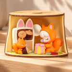 Example Rolife Nanci Tree House Party squirrel figure with a gift in a woodland room. Blind-box design varies.